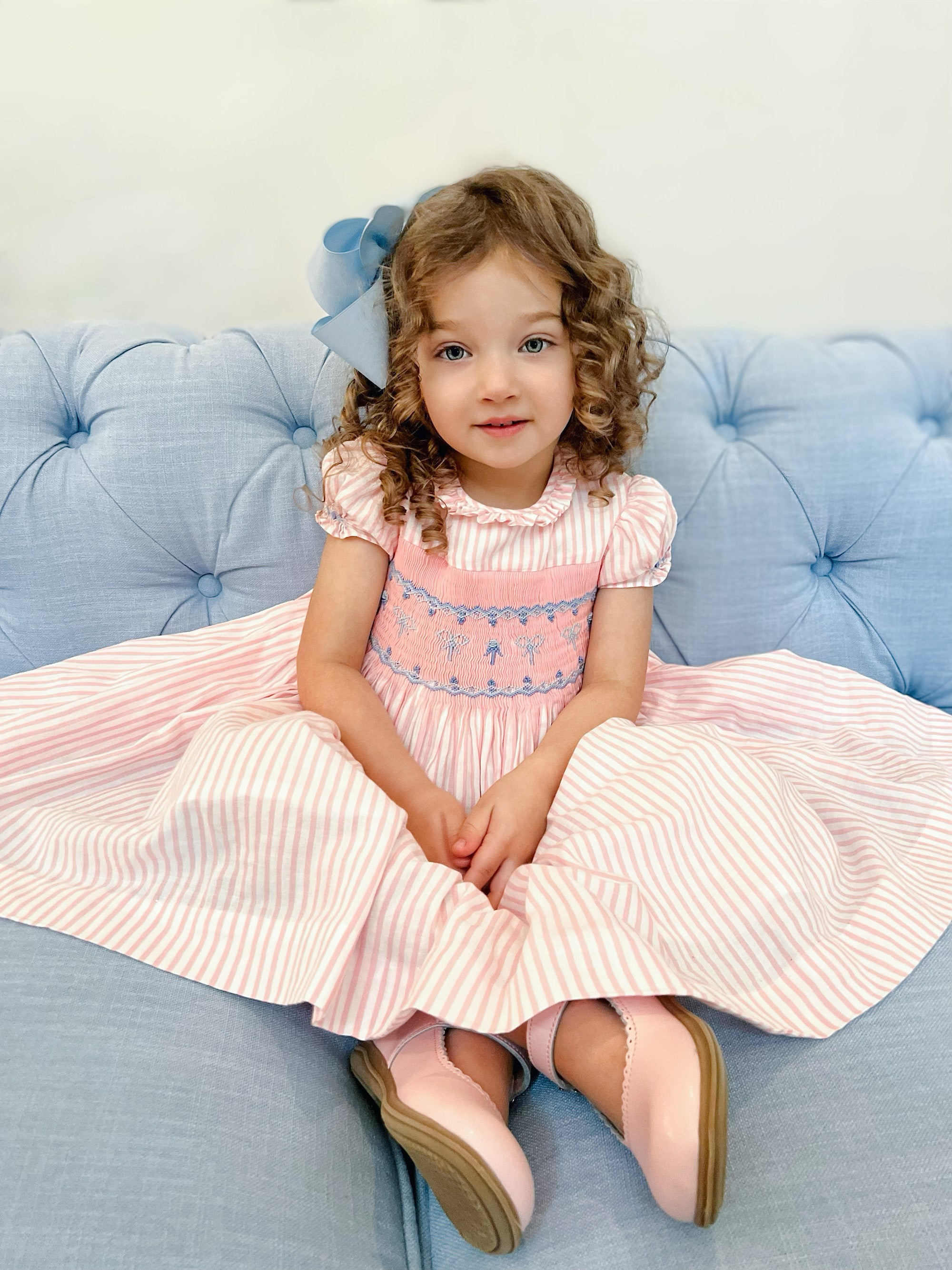Charlotte sy Dimby classic timeless traditional smocked dresses for babies and girls handmade French style children clothing paris boutique child portrait heirloom pink pastel striped dress north carolina